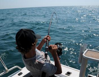 man deep sea fishing