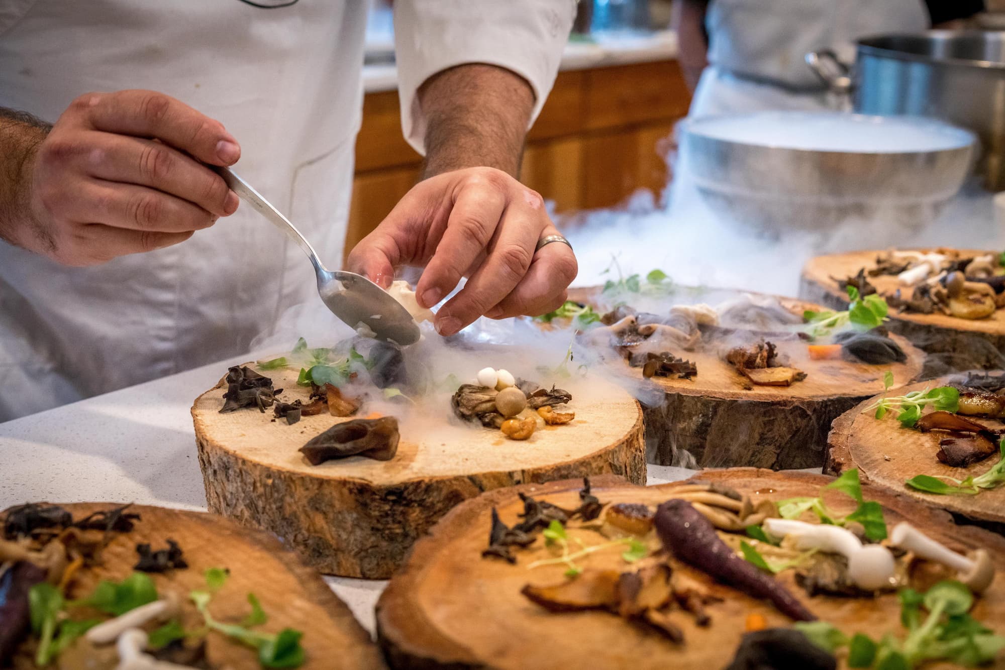 chef with smoked mushrooms